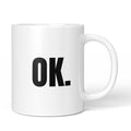 Brüllerware Tasse mit Spruch „OK.“ – weiße Keramiktasse mit schwarzem Statement-Druck und Brüllerware Icon