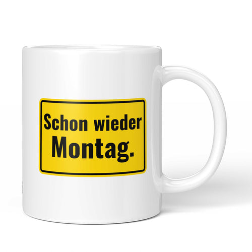 Brüllerware Tasse mit Spruch „Schon wieder Montag“ – weiße Keramiktasse mit schwarzem Statement-Druck und Brüllerware Icon