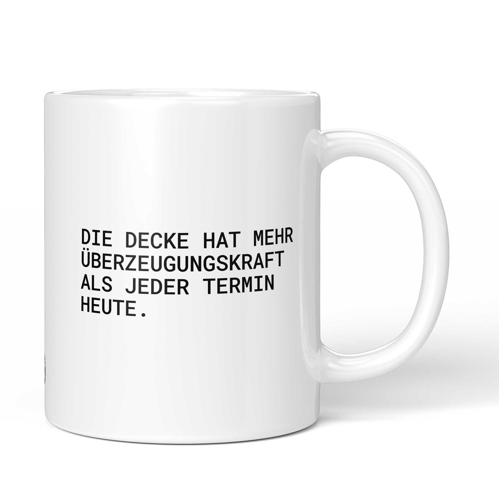 Weiße Keramiktasse mit dem Spruch „Die Decke hat mehr Überzeugungskraft als jeder Termin heute.“ von Brüllerware