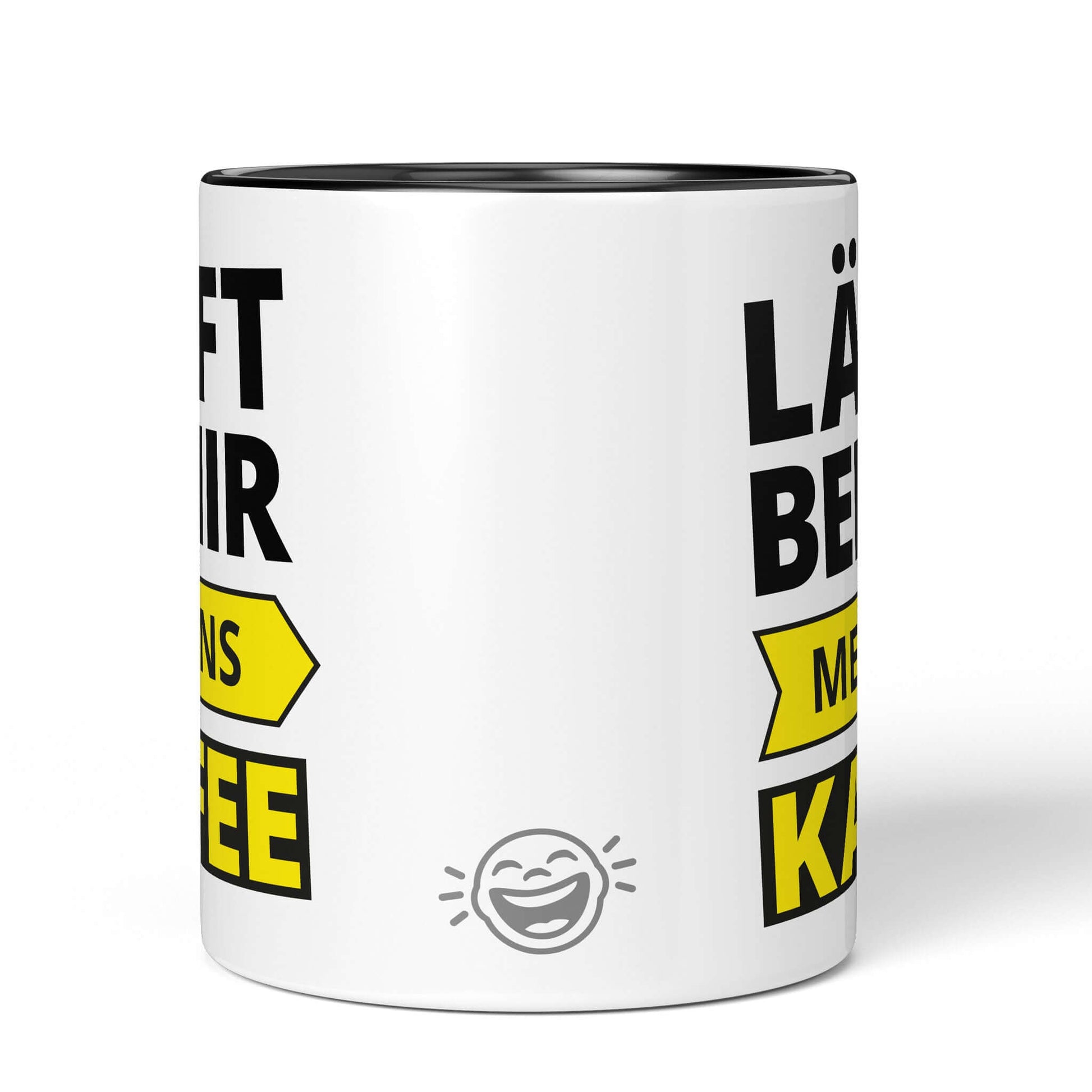 Black and white mug with BRÜLLERWARE logo on back – clean, playful design
