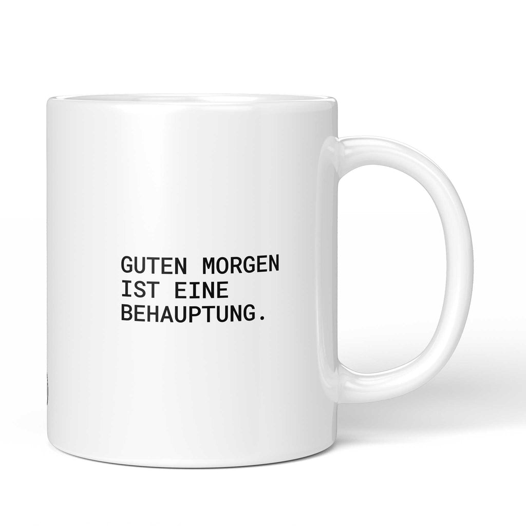 Lustige Tasse mit Spruch „Guten Morgen ist eine Behauptung." – weiße Keramiktasse mit schwarzem Druck, Vorderansicht