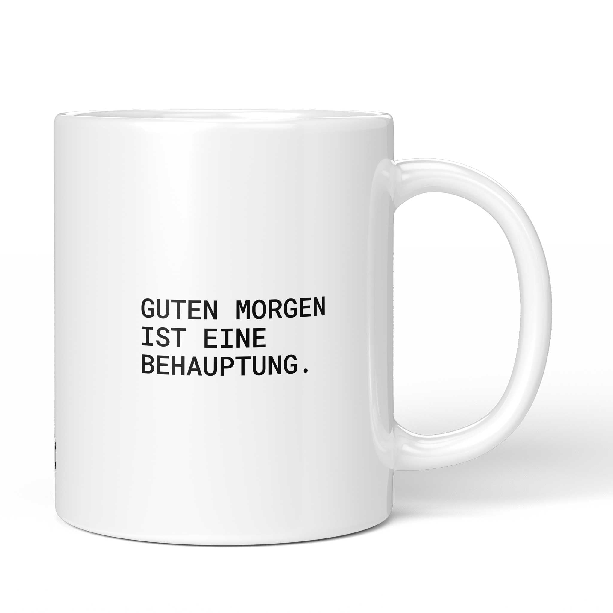 Lustige Tasse mit Spruch „Guten Morgen ist eine Behauptung." – weiße Keramiktasse mit schwarzem Druck, Vorderansicht