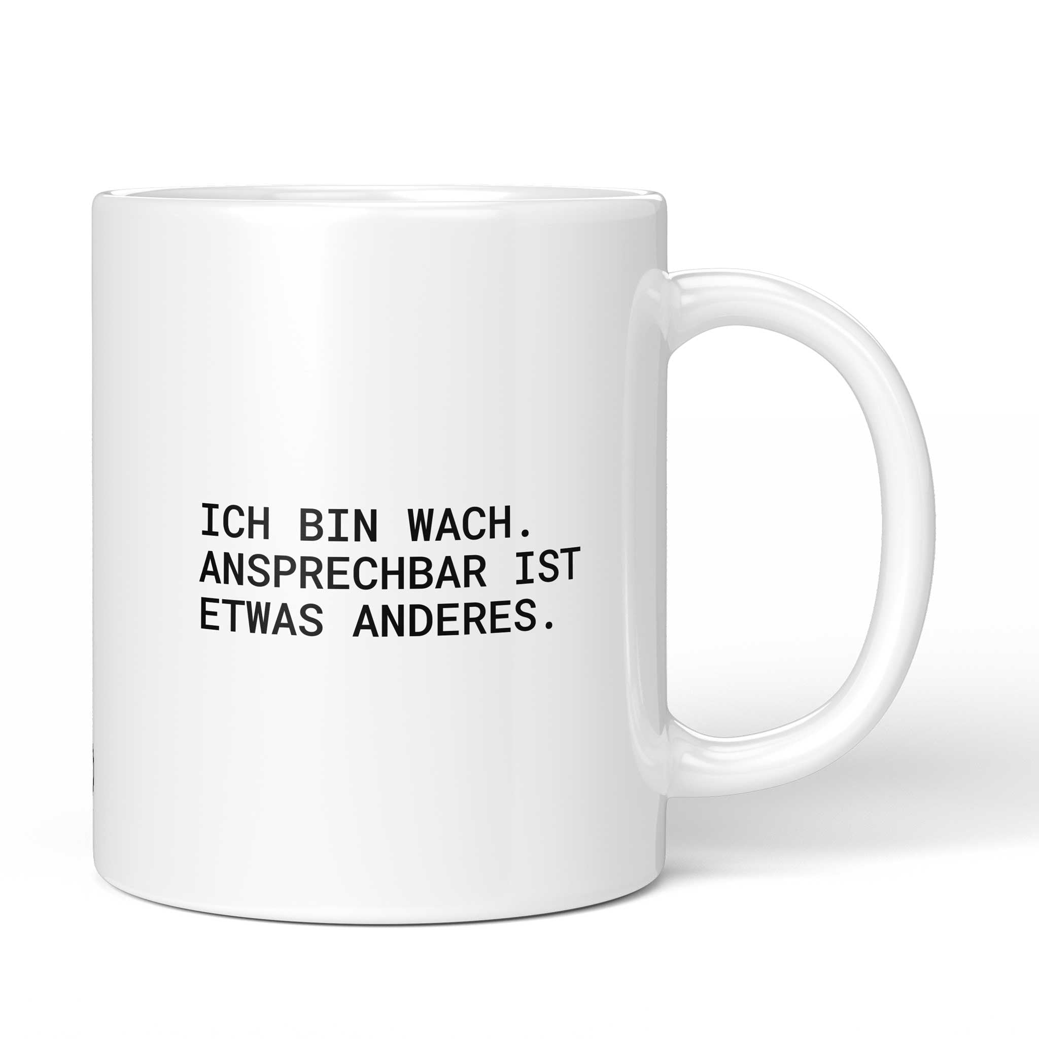 Lustige Tasse mit Spruch „Ich bin wach. Ansprechbar ist etwas anderes." – weiße Keramiktasse mit schwarzem Druck, Vorderansicht