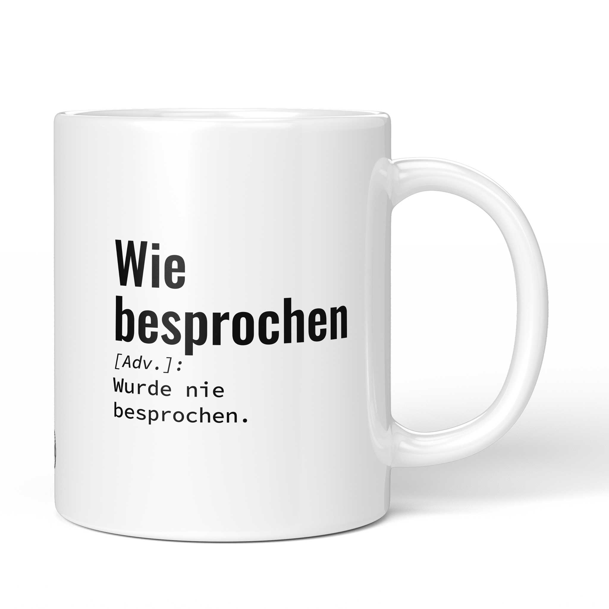 Lustige Tasse mit Spruch „Wie besprochen: Wurde nie besprochen." – weiße Keramiktasse mit schwarzem Druck, Vorderansicht