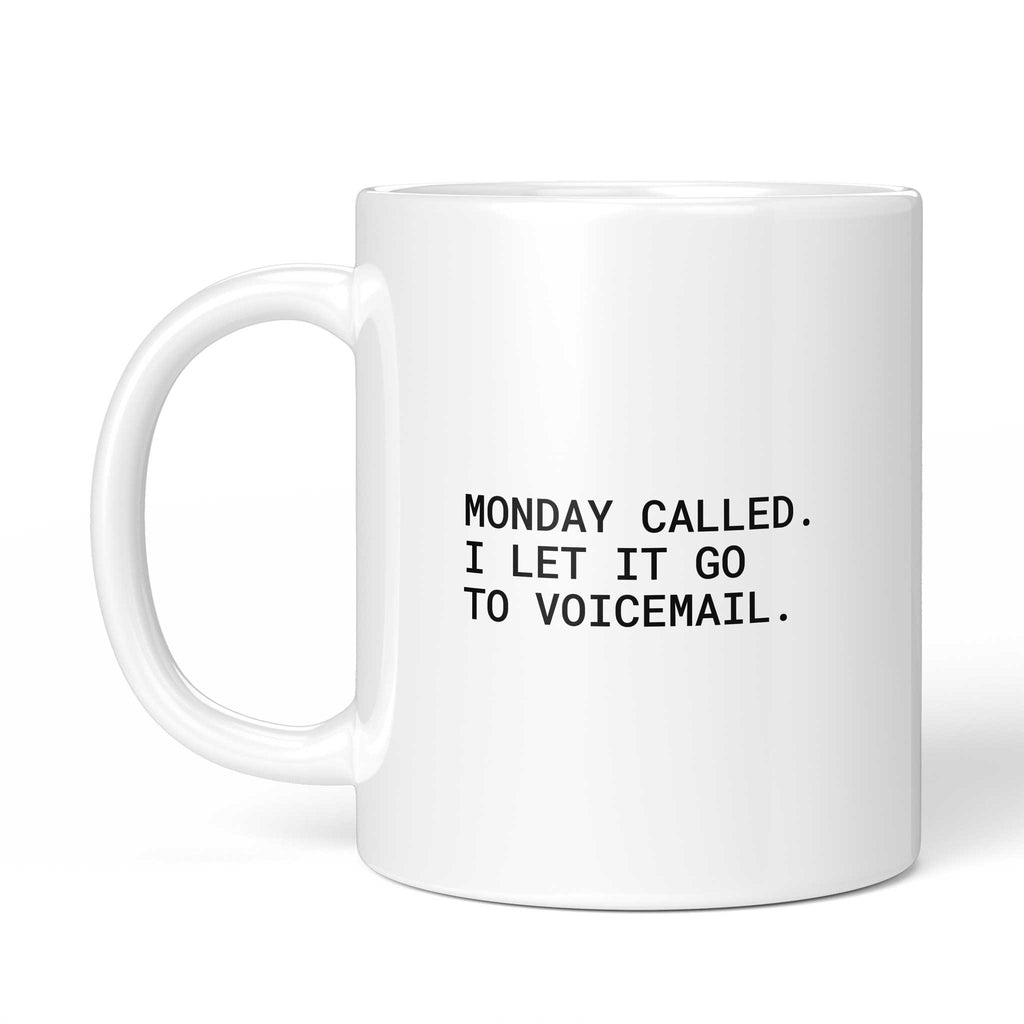 Weiße Tasse „Monday called. I let it go to voicemail.“ mit Henkel links