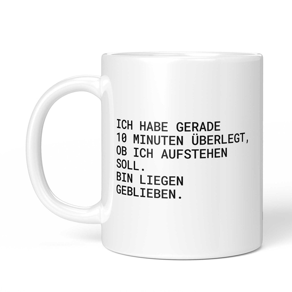 Tasse „Ich habe gerade 10 Minuten überlegt, ob ich aufstehen soll....“ – Ansicht mit Henkel links