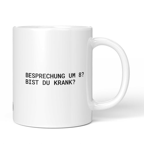 Weiße Tasse mit Spruch „Besprechung um 8? Bist du krank?“ – Brüllerware