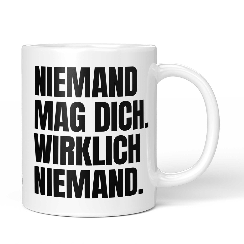Brüllerware Tasse mit Spruch „Niemand mag dich. Wirklich niemand.“ – weiße Keramiktasse mit schwarzem Statement-Druck und Brüllerware Icon