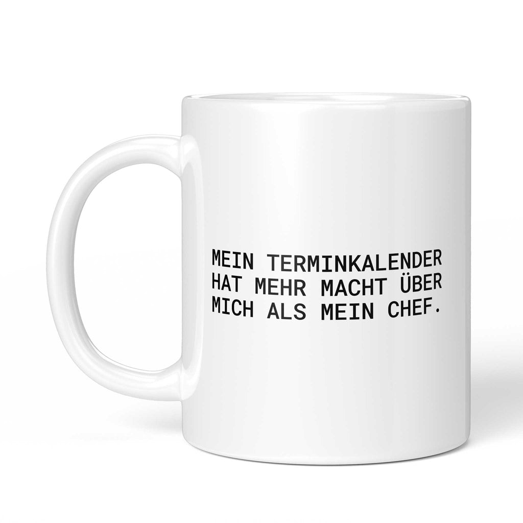 Weiße Tasse „Mein Terminkalender hat mehr Macht über mich“ mit Henkel links