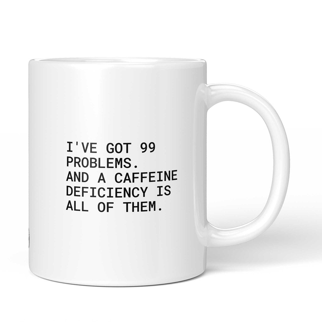 Weiße Keramiktasse mit dem Spruch „I’ve got 99 problems – and a caffeine deficiency is all of them.“ von Brüllerware