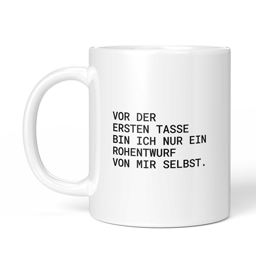 Weiße Tasse „Vor der ersten Tasse bin ich nur ein Rohentwurf“ mit Henkel links